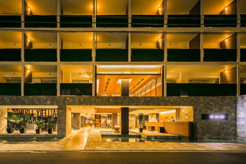 an office building at night with lights on at Sakura Terrace The Gallery in Kyoto