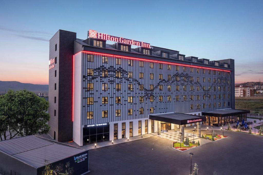 a large building with a heart on the side of it at Hilton Garden Inn Erzurum in Erzurum
