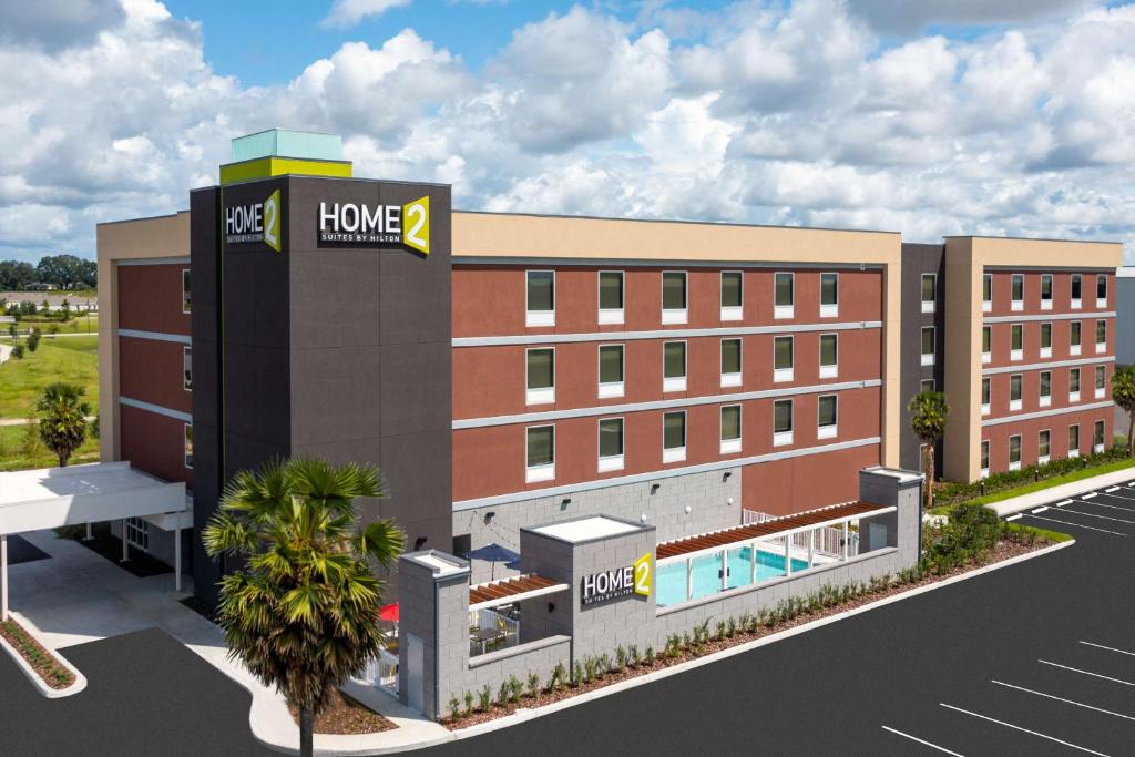 a rendering of a home healthcare building with a pool at Home2 Suites By Hilton Wildwood The Villages in Wildwood