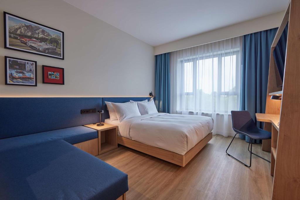 Posteľ alebo postele v izbe v ubytovaní Hampton By Hilton Poznan Swarzedz