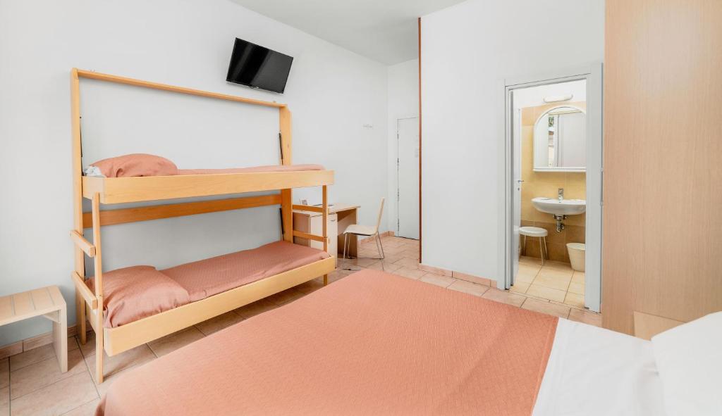 Postel nebo postele na pokoji v ubytování HOTEL OLIVER