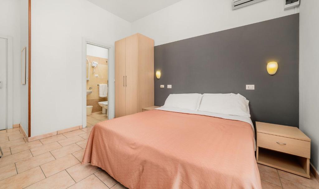 Postel nebo postele na pokoji v ubytování HOTEL OLIVER