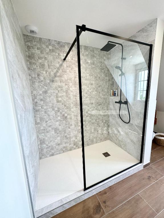 a shower with a glass door in a bathroom at LUXURY ! Maison spacieuse de standing – Proche des plages in Ploemeur