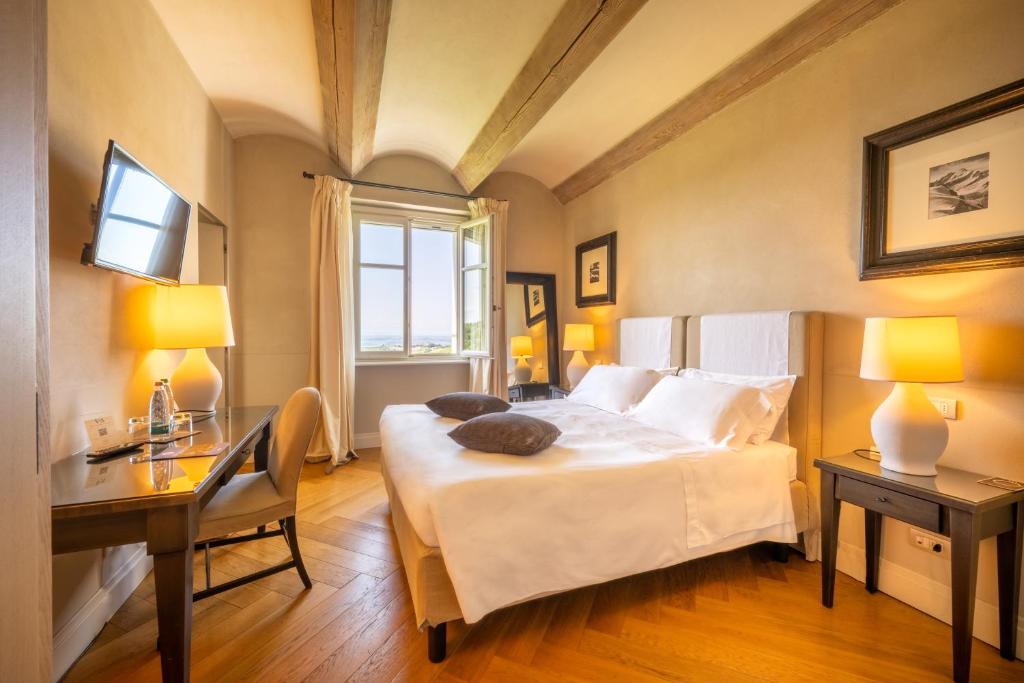 Postel nebo postele na pokoji v ubytování Relais Villa D'Amelia