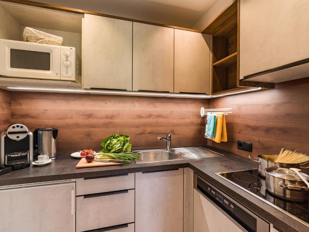Kuchyň nebo kuchyňský kout v ubytování Apartments Schöne Aussicht
