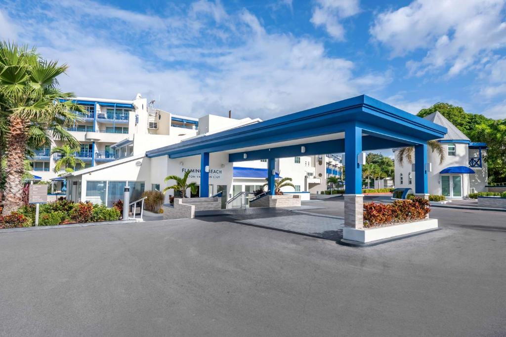 a large white building with a blue roof at Hilton Vacation Club Flamingo Beach Sint Maarten in Simpson Bay