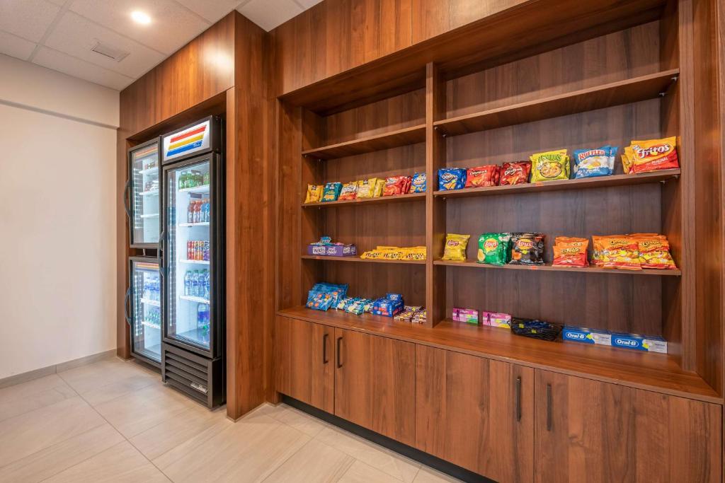 a food pantry with cookies and snacks on shelves at Hilton Vacation Club Flamingo Beach Sint Maarten in Simpson Bay