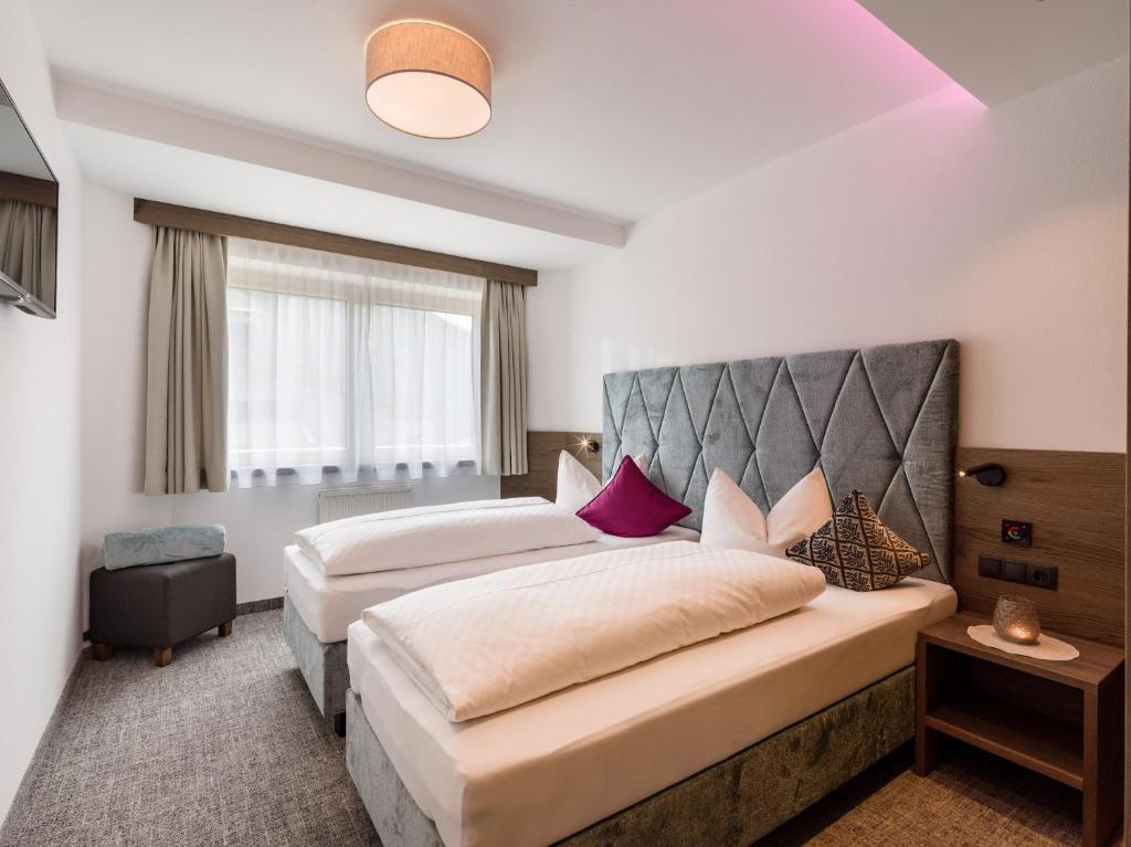 Postel nebo postele na pokoji v ubytování Apartments Schöne Aussicht