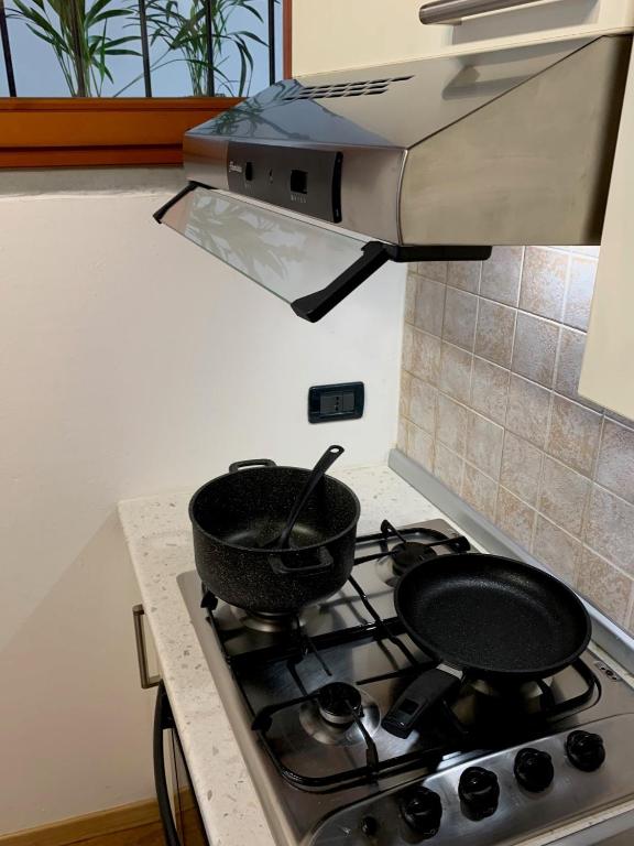 Kuchyň nebo kuchyňský kout v ubytování Quadrisfera Apartment