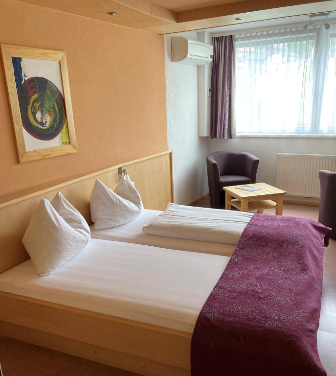 Postel nebo postele na pokoji v ubytování Hotel Kleißl