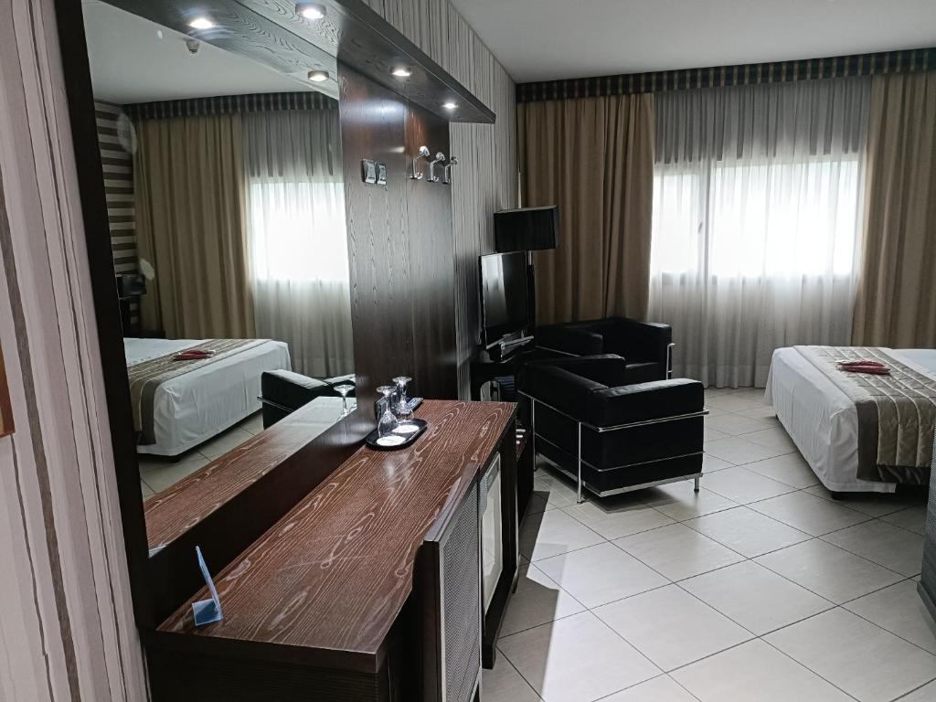 Postel nebo postele na pokoji v ubytování Green Hotel Ninfa