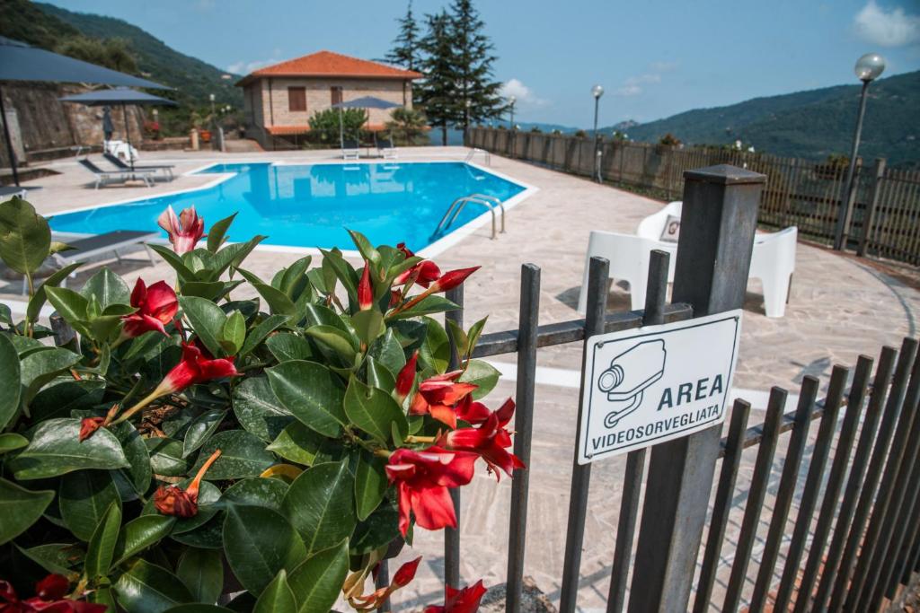 a fence with a sign in front of a swimming pool at Quattroemme Soc Agricola in Sinagra