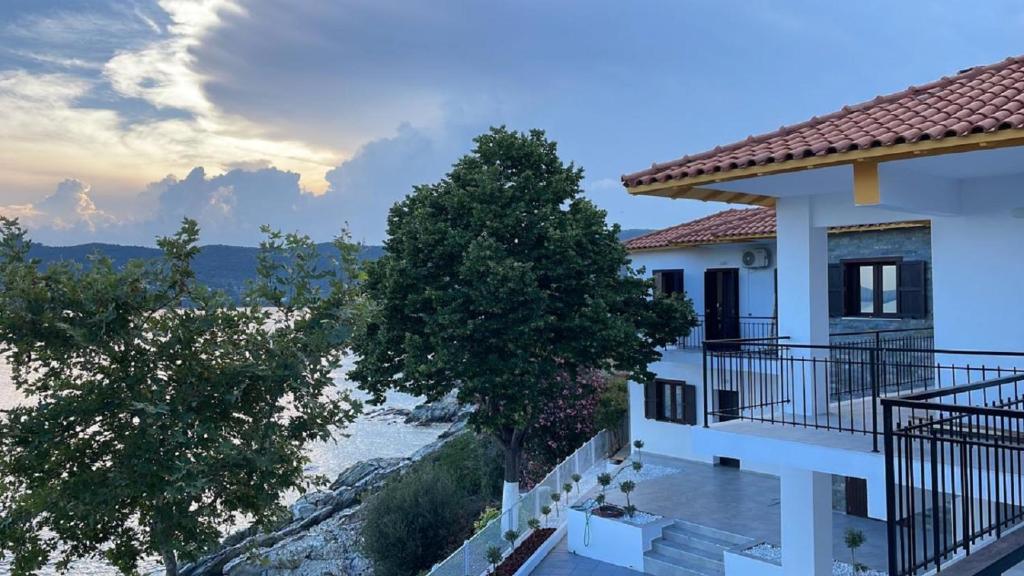 a house with a view of a river at Athos Cape in Pyrgadikia