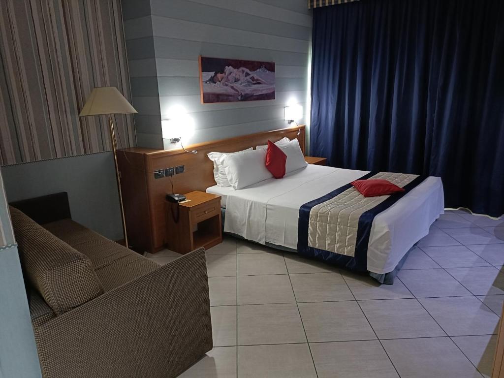 Postel nebo postele na pokoji v ubytování Green Hotel Ninfa