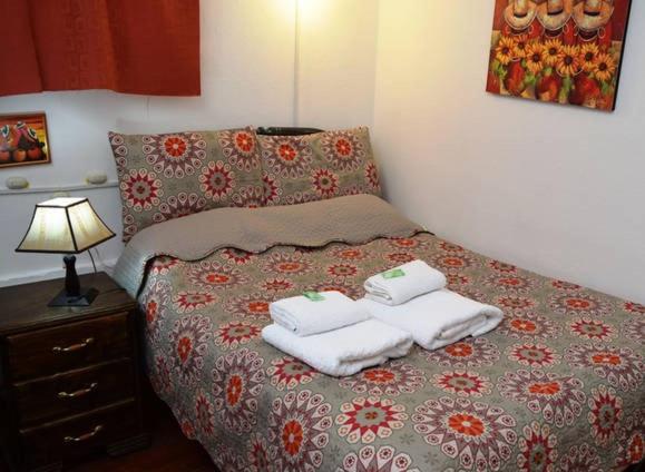 Ένα ή περισσότερα κρεβάτια σε δωμάτιο στο Carlos Guest House 1 Cusco