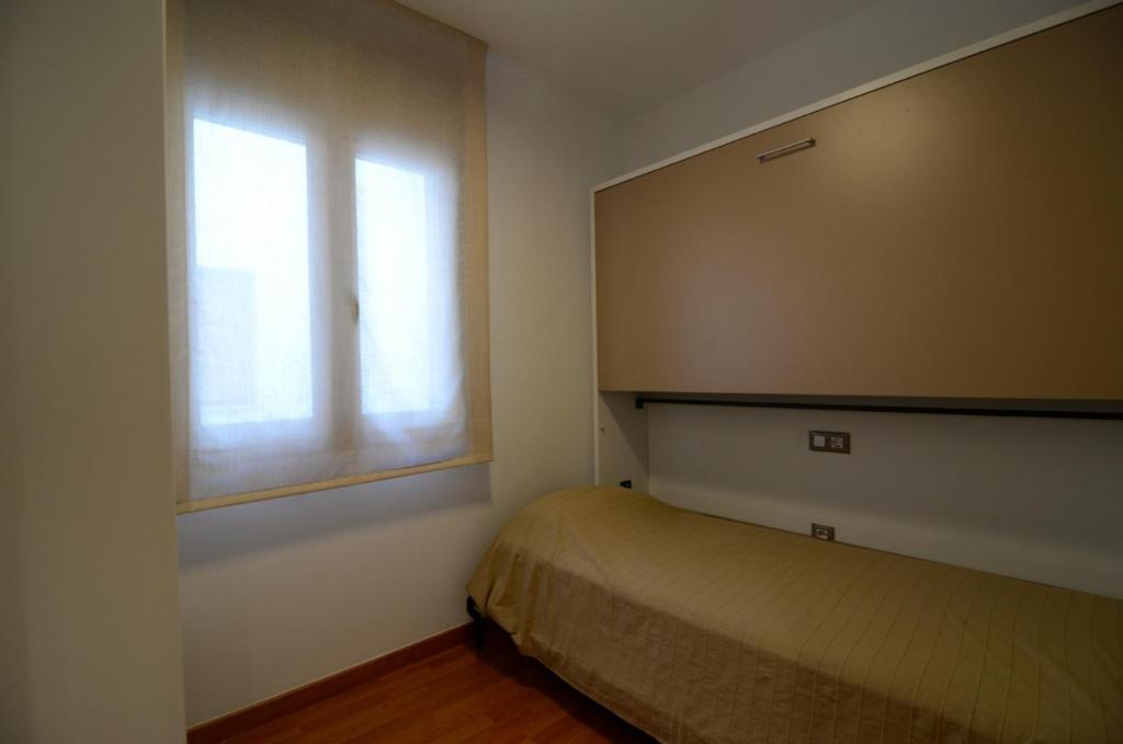 Posteľ alebo postele v izbe v ubytovaní Gracia - apartamentos
