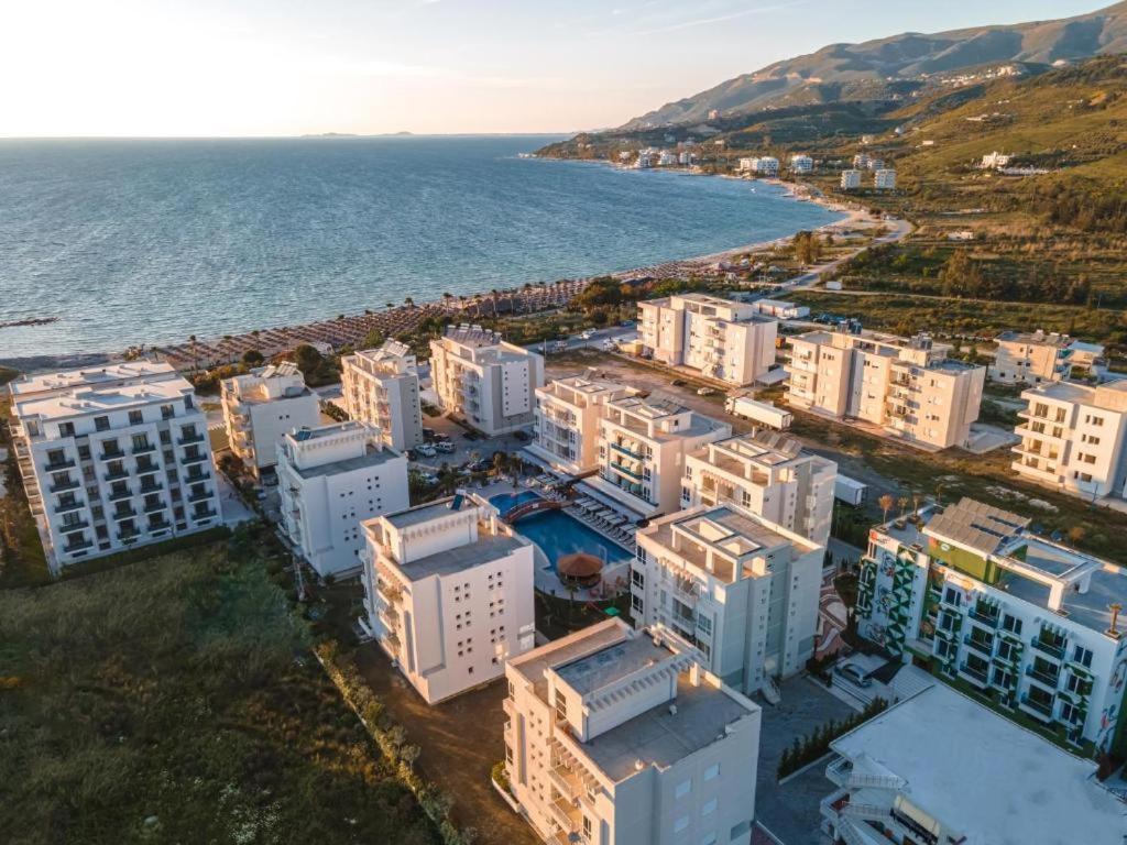 an aerial view of a city next to the ocean at Apartman Martini in Orikum