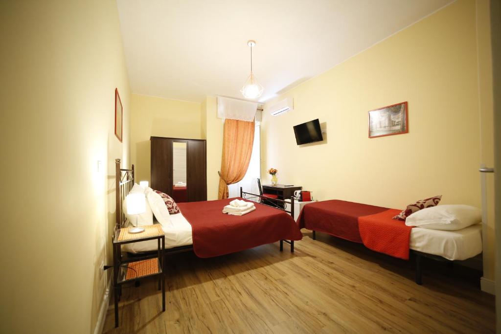 Łóżko lub łóżka w pokoju w obiekcie Al Quadrato D'Oro rooms