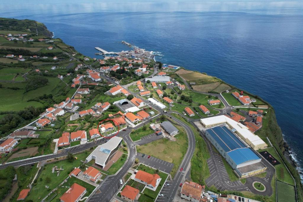 an aerial view of a town next to the water at Vila Flor in Lajes das Flores
