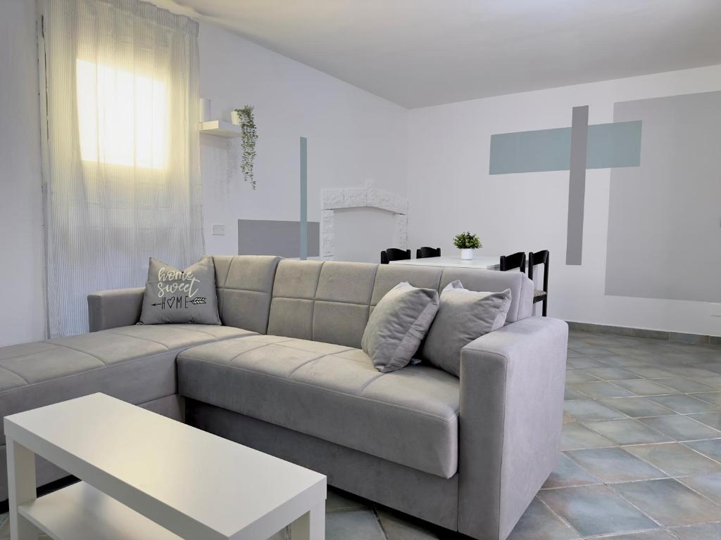 a living room with a couch and a table at Casa Vacanze Maride in Capitana