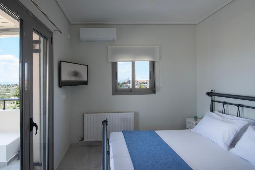 Postel nebo postele na pokoji v ubytování Aegina Divine View