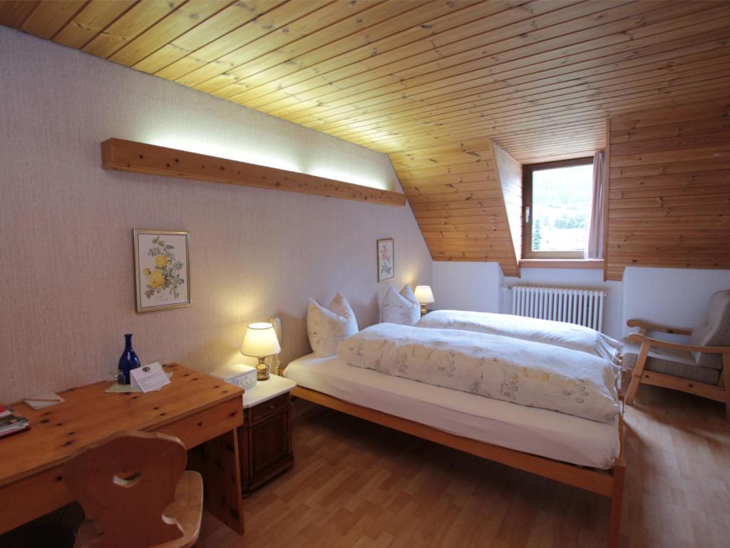 Postel nebo postele na pokoji v ubytování Hotel Schweizerhof Sta Maria