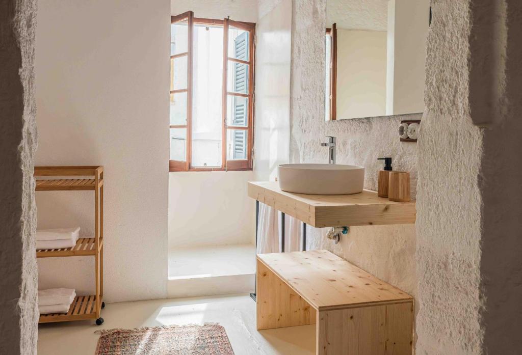 a bathroom with a sink and a window at Pere Alcantara 40, 3 bedroom house, Ciutadella in Ciutadella