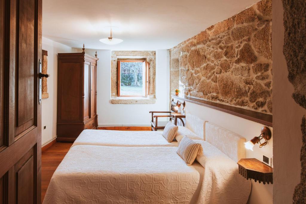 Postel nebo postele na pokoji v ubytování Casa Do Romualdo