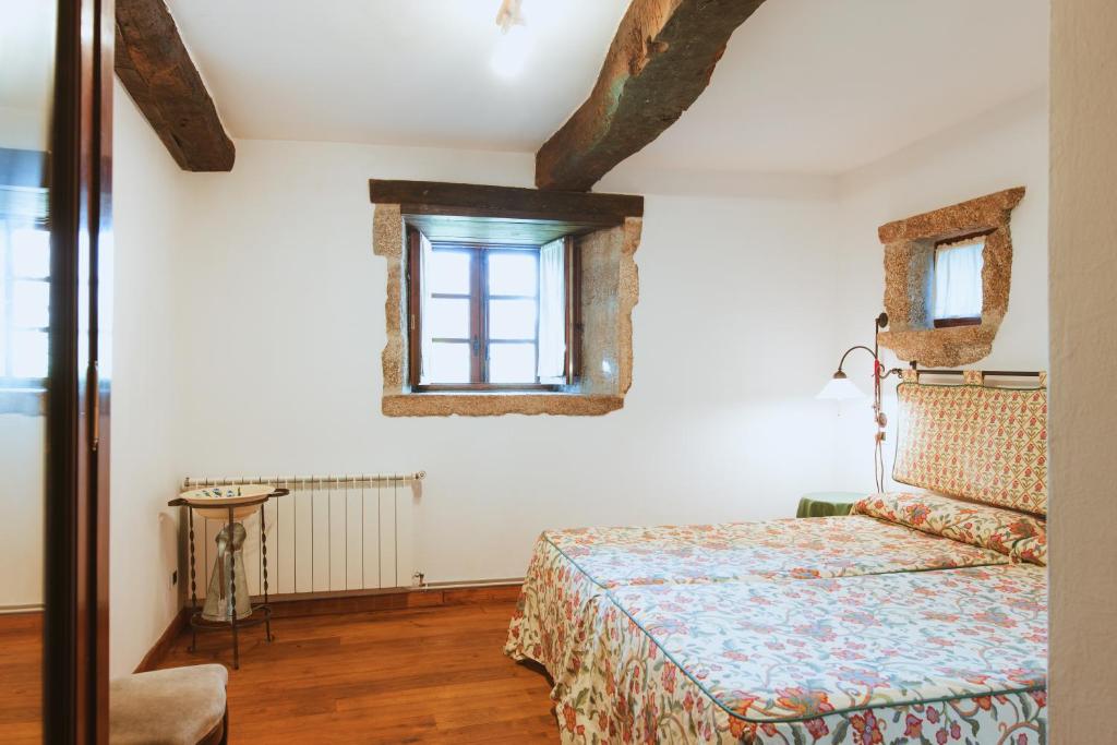 Postel nebo postele na pokoji v ubytování Casa Do Romualdo