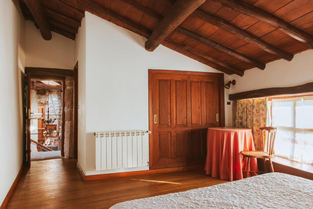Postel nebo postele na pokoji v ubytování Casa Do Romualdo
