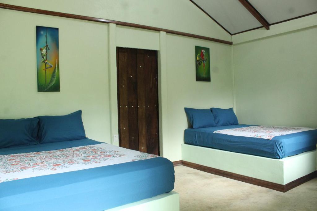 Postel nebo postele na pokoji v ubytování Cecropia Ecolodge