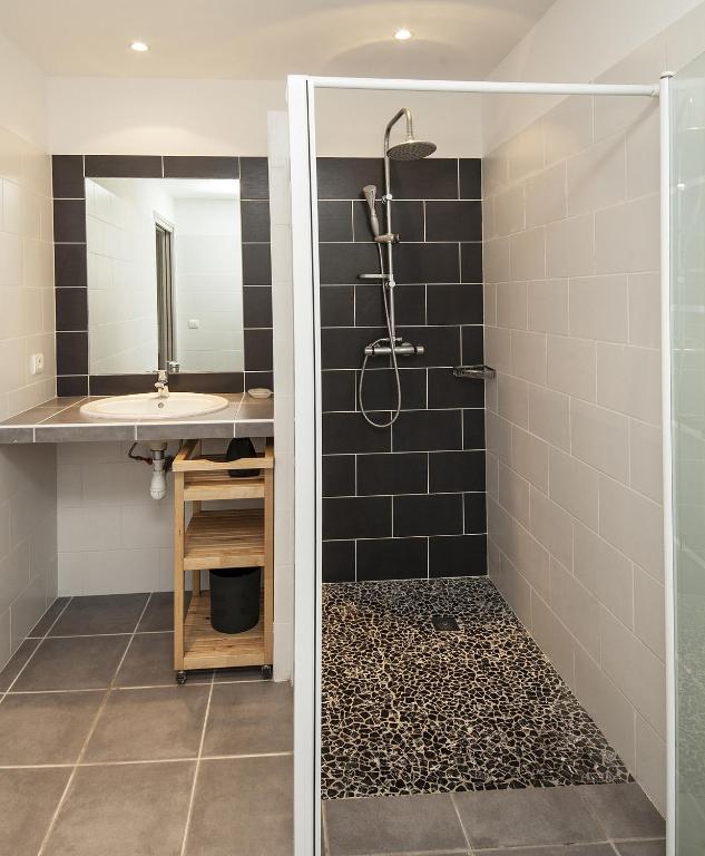 a bathroom with a shower and a sink at Résidence Santa Monica in Bonifacio