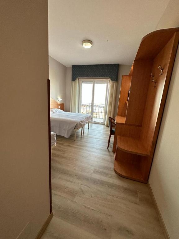 Postel nebo postele na pokoji v ubytování Hotel Costa Verde
