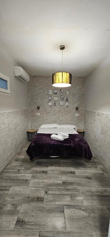 Postel nebo postele na pokoji v ubytování Hostal La Cabaña