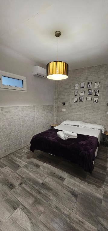 Postel nebo postele na pokoji v ubytování Hostal La Cabaña