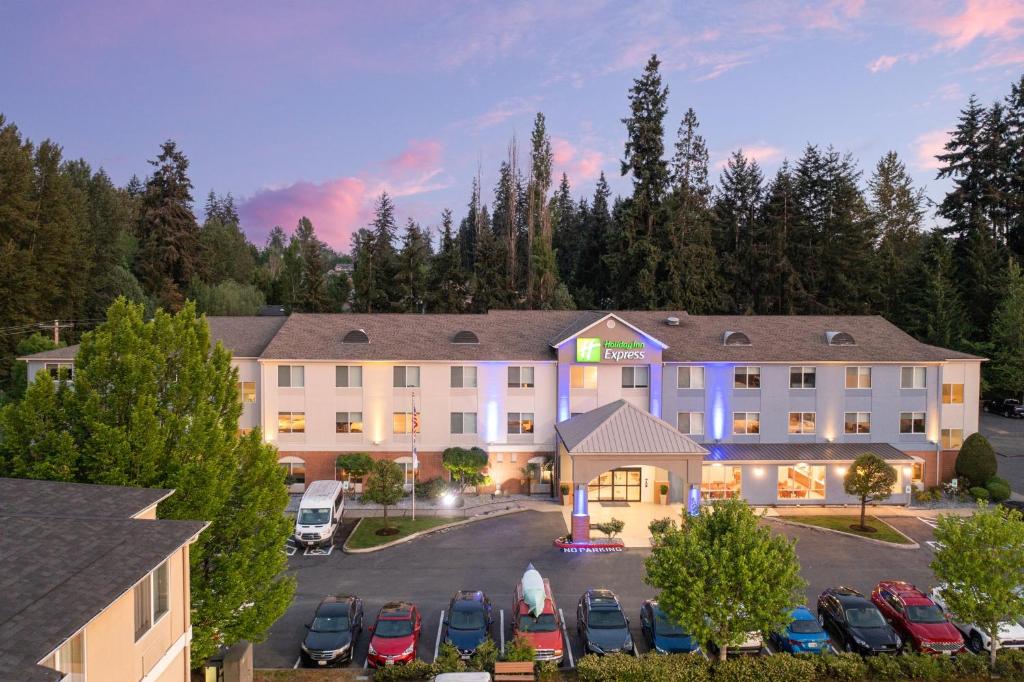 an aerial view of a hotel with a parking lot at Holiday Inn Express Bothell by IHG in Bothell