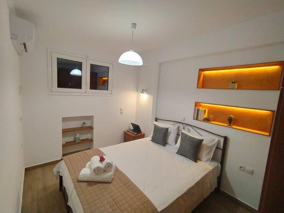 a bedroom with a bed with a stuffed animal on it at Sergi Home in Raches
