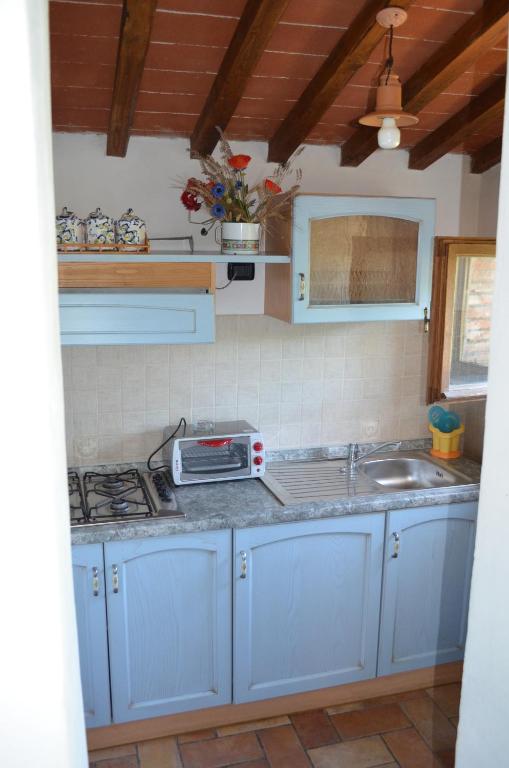 Kuchyň nebo kuchyňský kout v ubytování Residence Lucignano
