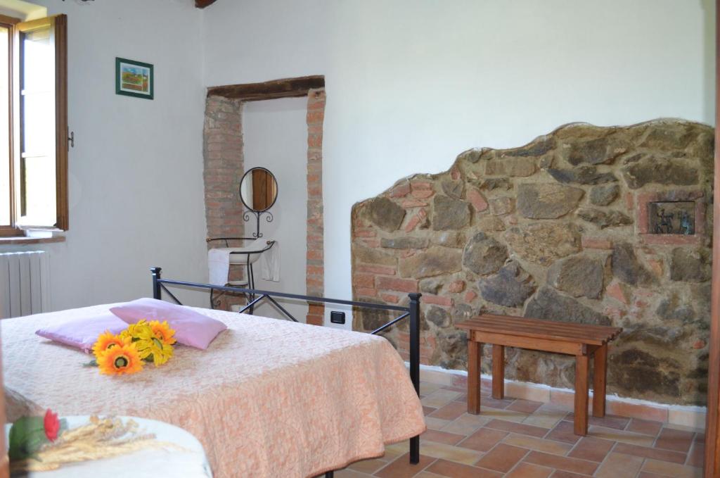 Postel nebo postele na pokoji v ubytování Residence Lucignano