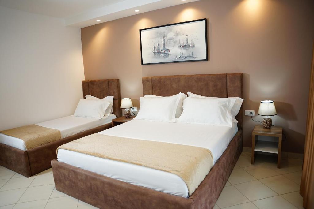 Postel nebo postele na pokoji v ubytování Atrium Deluxe Resort