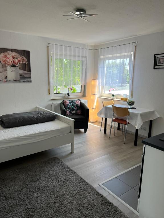 a living room with a couch and a table at Apartment Nr. 5 am Stuttgarter Flughafen/Messe in Leinfelden-Echterdingen