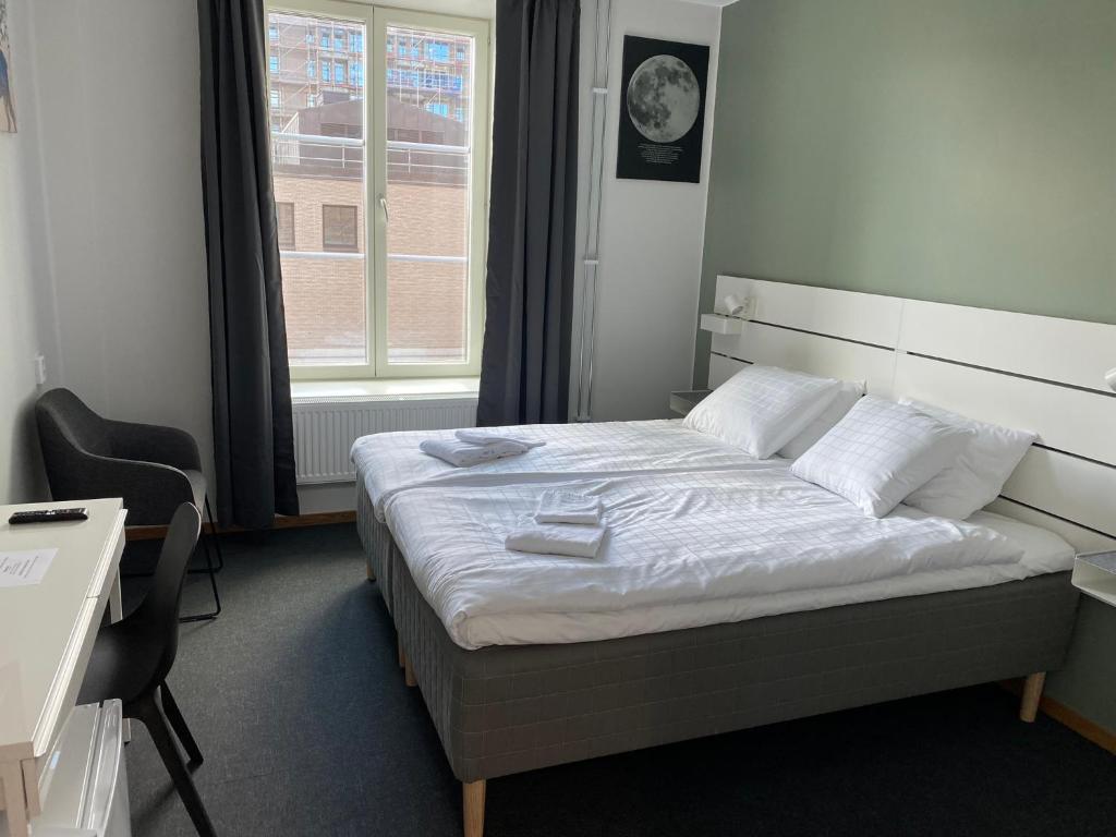 Postel nebo postele na pokoji v ubytování Ahlgrens Hotell Bed & Breakfast