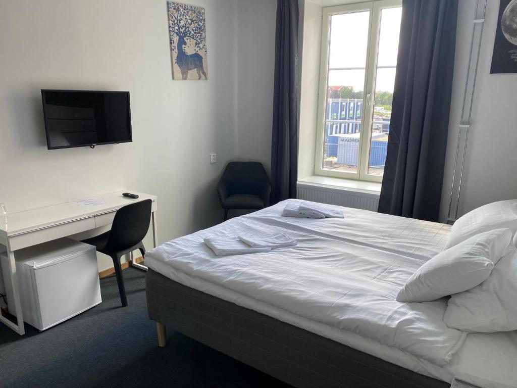 Postel nebo postele na pokoji v ubytování Ahlgrens Hotell Bed & Breakfast