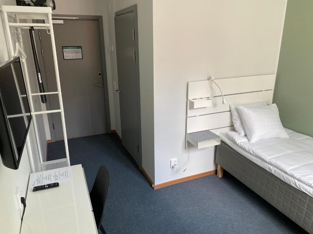 Postel nebo postele na pokoji v ubytování Ahlgrens Hotell Bed & Breakfast