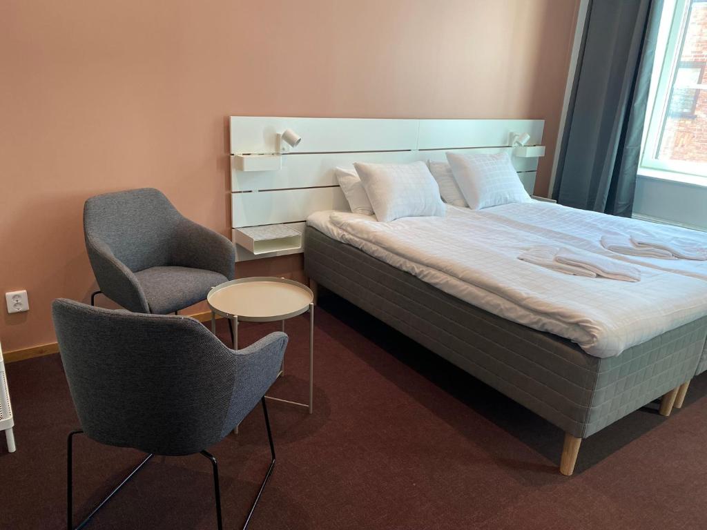 Postel nebo postele na pokoji v ubytování Ahlgrens Hotell Bed & Breakfast