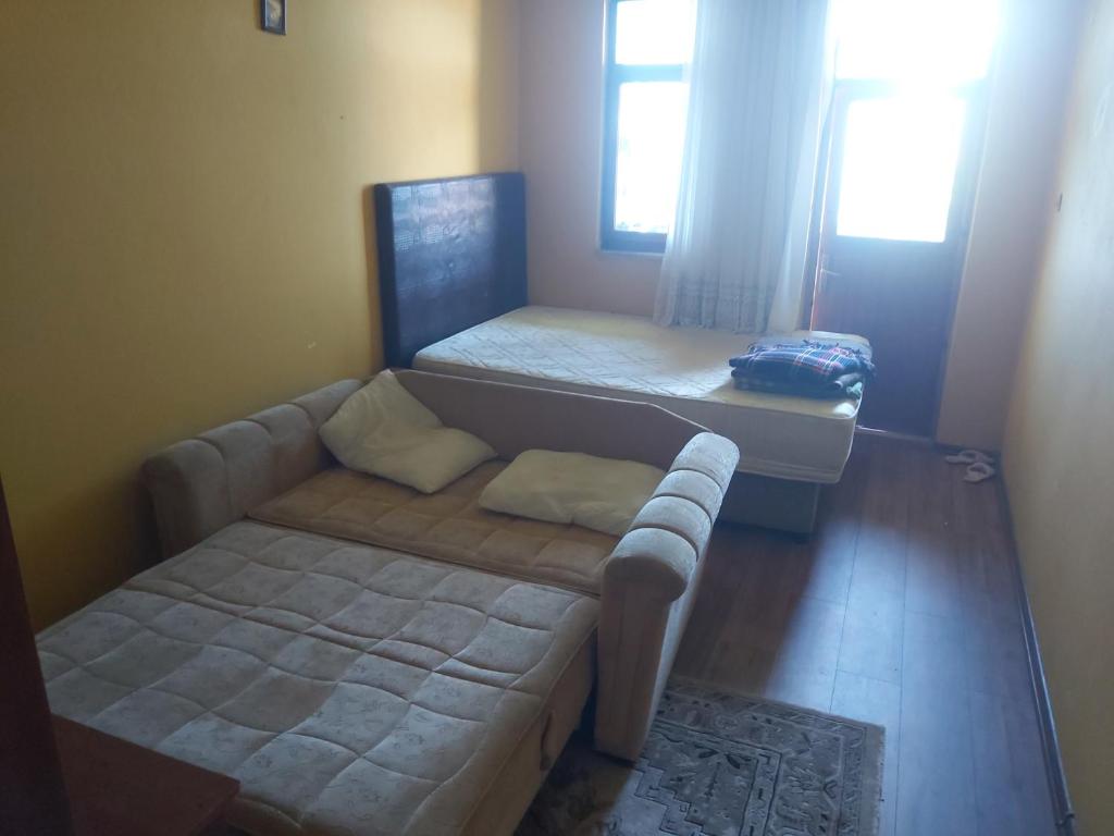 Postel nebo postele na pokoji v ubytování kutuban hostel özel oda