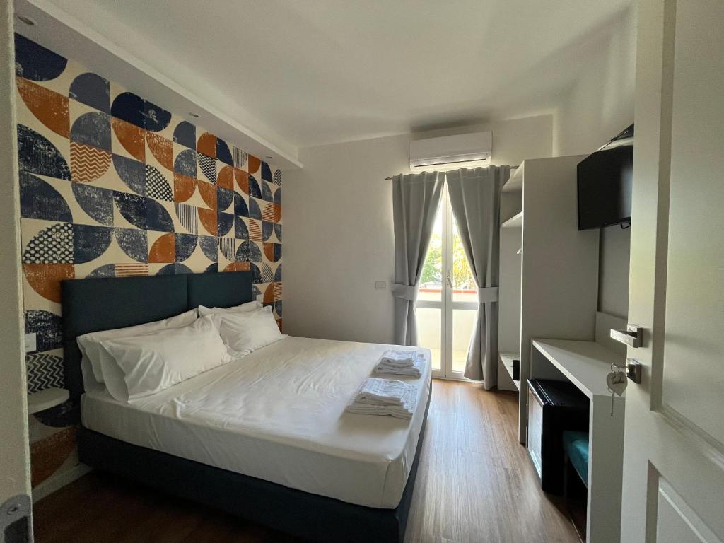 a small bedroom with a bed and a window at Levar Del Sole in Passignano sul Trasimeno