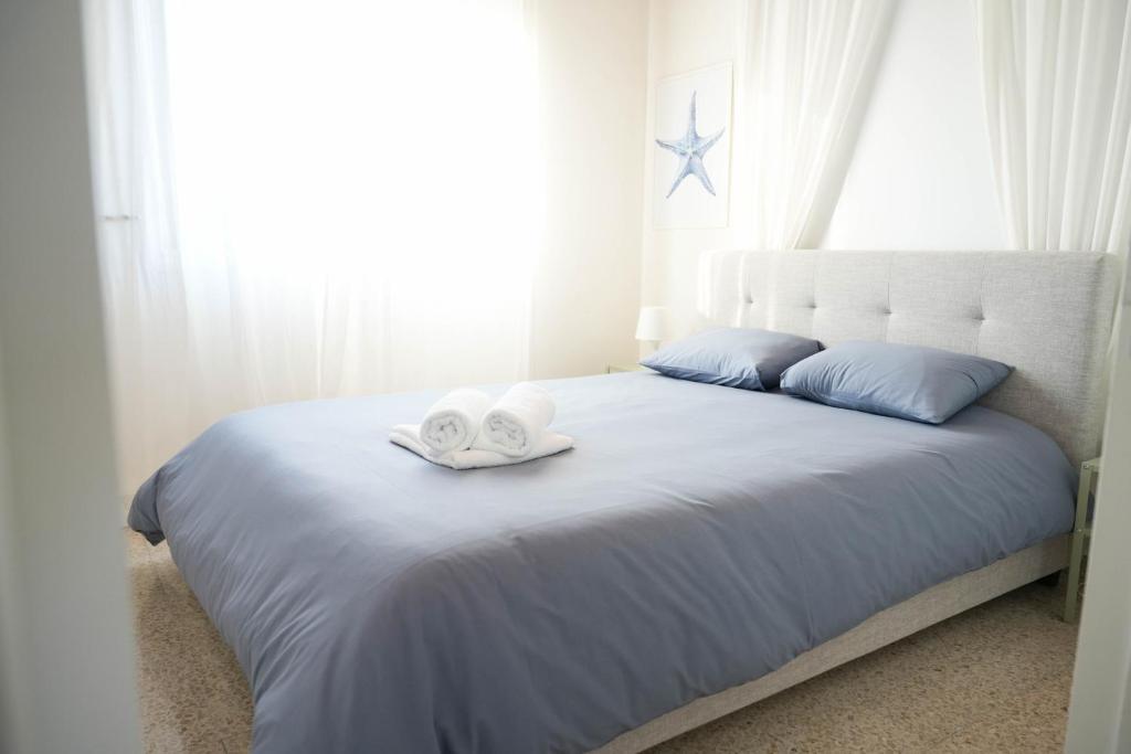 Postel nebo postele na pokoji v ubytování Ocean Blue House 17