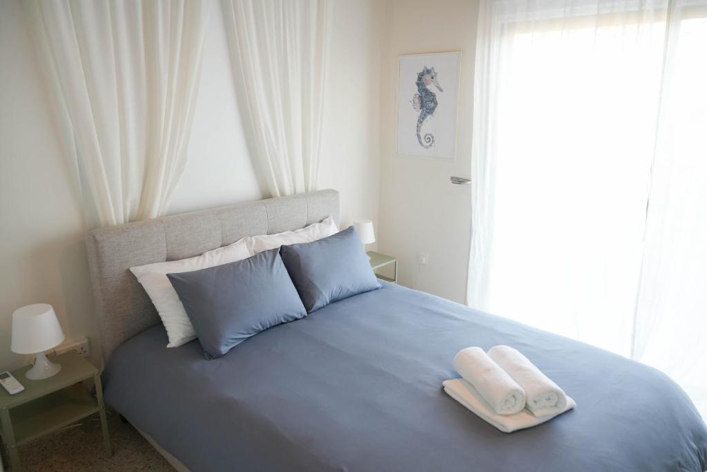 Postel nebo postele na pokoji v ubytování Ocean Blue House 17
