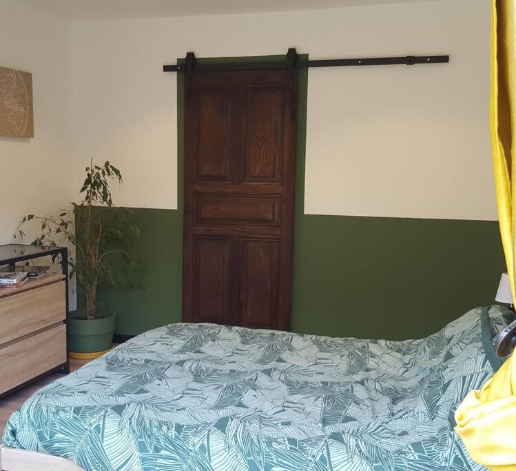 Cama o camas de una habitación en Appartement 2 pieces